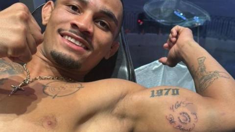 Brazilian flyweight Andre Lima shows off his new tattoo on his biceps