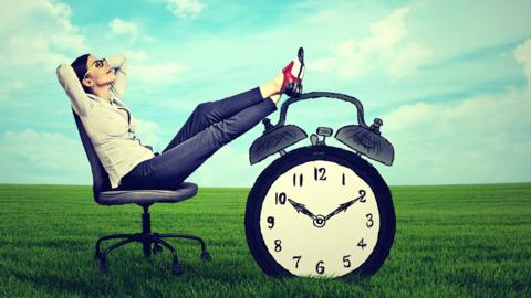 Woman relaxing in office chair outside