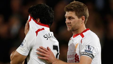 Liverpool captain Steven Gerrard consoles team-mate Luis Suarez who is reduced to tears after his team draw 3-3 with Crystal Palace