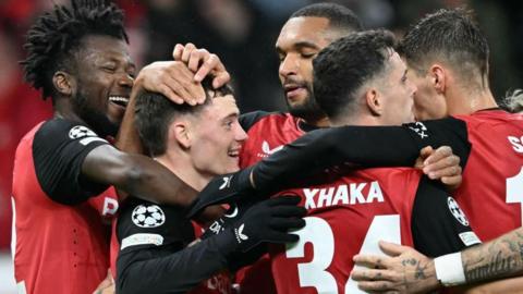 Florian Wirtz celebrates with his Bayer Leverkusen team-mates after scoring against Red Bull Salzburg in the Champions League