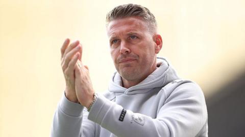 Rob Edwards clapping the fans during a Middlesbrough game