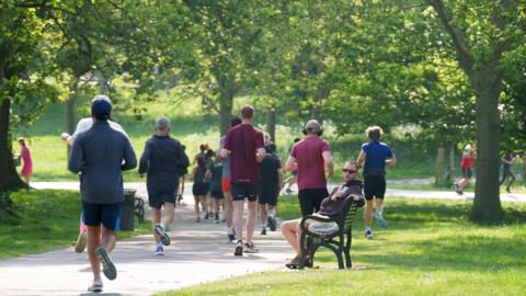 People running in a park