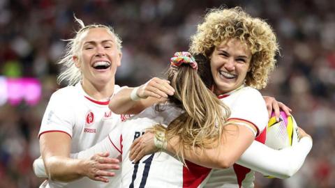 Jess Breach of England celebrates with teammate Ellie Kildunne.