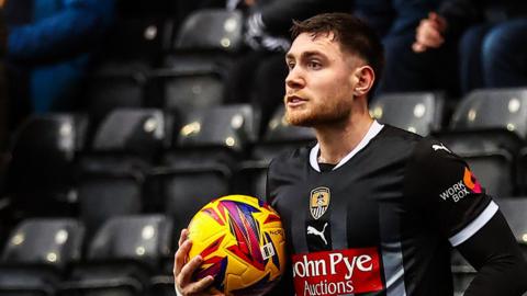 Cedwyn Scott about to take a throw-in for Notts County