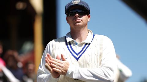 Steve Smith looks on