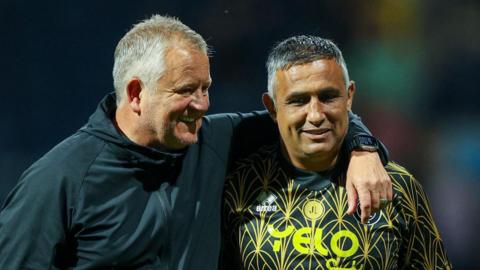 Chris Wilder (left) with his arm around first-team coach Jack Lester