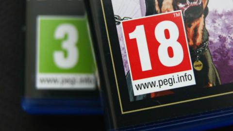 two games boxes, one out of focus rated PEGI 3 and one in focus rated PEGI 18