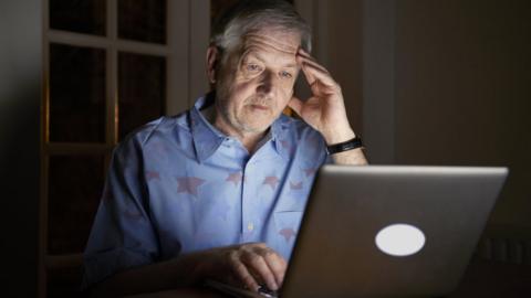 Man at a computer (stock image)