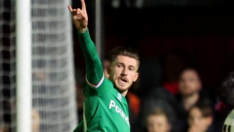 Walsall football player Thomas Andrew Knowles celebrates scoring his side's second goal during the Emirates FA Cup