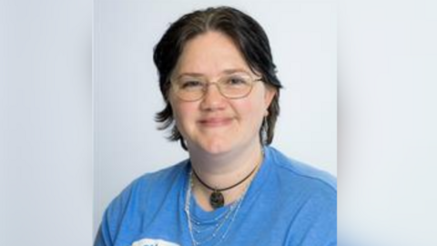 Jodie Watts' Bracknell Forest Council picture, with her wearing a few necklaces and a blue T-shirt. She has short, dark hair.