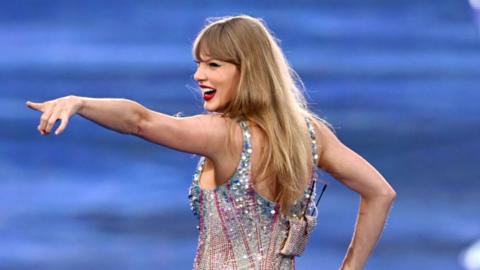Taylor Swift pointing during performance