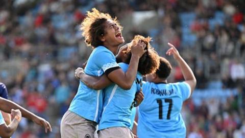 Fiji players celebrate