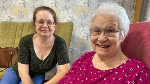 Carol Spencer and her mother Barbara smiling at the camera