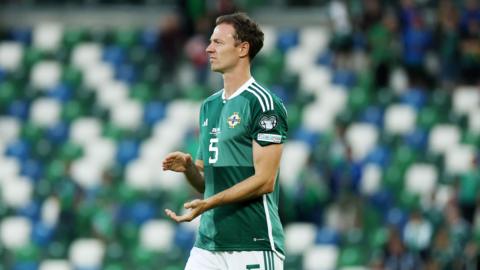 Jonny Evans applauds the crowd