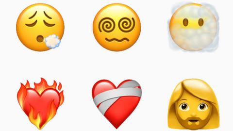 Six new emojis including a face exhaling, woman with beard and heart on fire