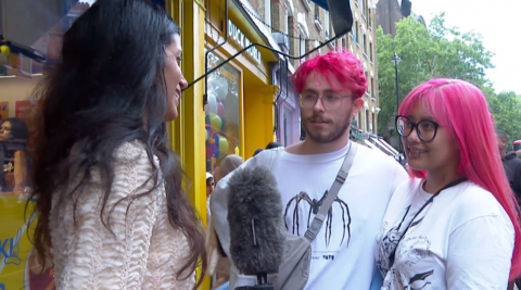 BBC's culture reporter Noor Nanji speaks to a couple with pink hair