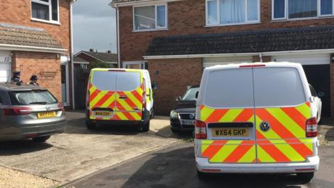 Police vans outside a house in Thames Close