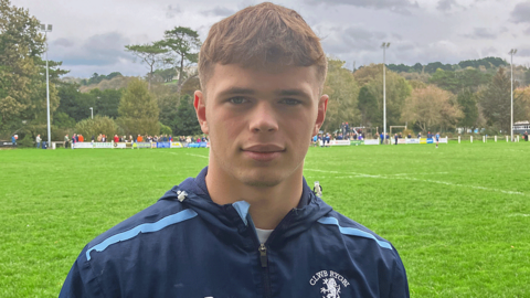 Keir Creasey in his blue Aberystwyth RFC stands on the pitch