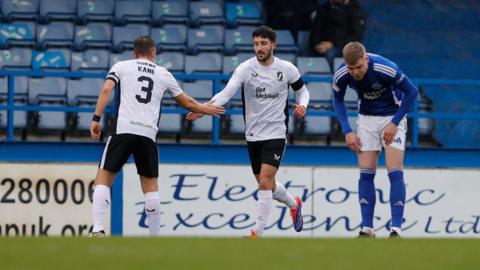 Danny Amos celebrates his goal