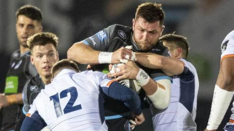 Ryan Wilson in the thick of the action against Edinburgh