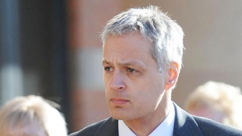 Robin Garbutt wearing a grey suit, arriving at Teesside Crown Court, Middlesbrough for the start of his trial in 2011, where he convicted of murdering his postmistress wife, Diana