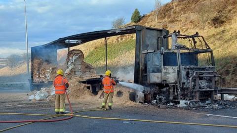 Burnt out lorry on M62