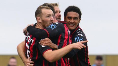 Truro City players celebrate a win