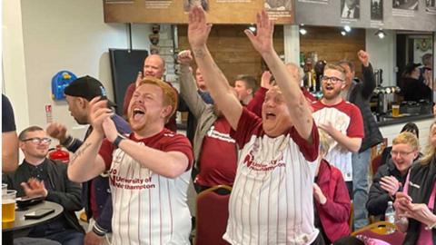 Northampton fans celebrate at Sixfields