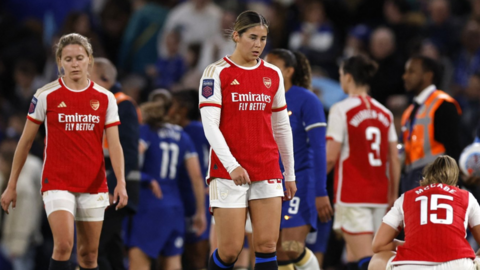 Arsenal players react after their loss to Chelsea