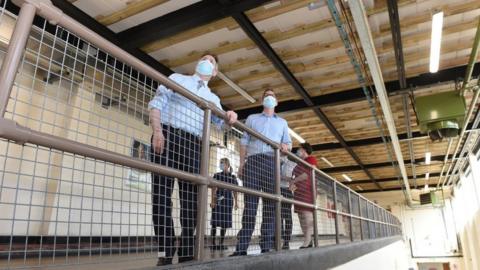 Health minister Edward Argar inspecting safety works at the Queen Elizabeth Hospital in King's Lynn