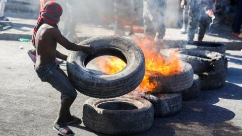 Protesters burn tyres in Port au Prince on 7 February 2021