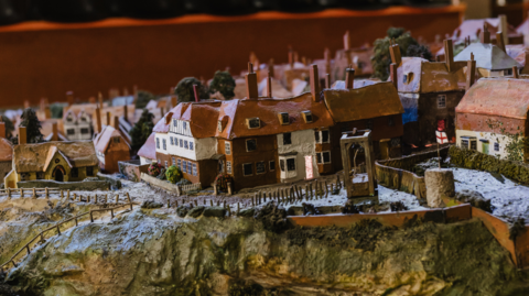 The hand‑carved scale model of Rye.