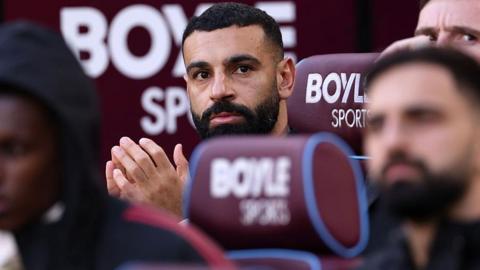 Mohamed Salah watches from the bench as Liverpool win at West Ham United