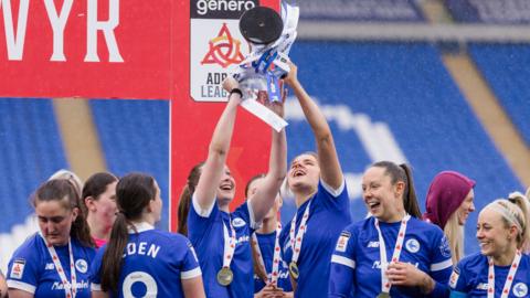 Cardiff City women players celebrate winning the league