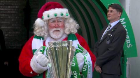 Santa presents Celtic with trophy 