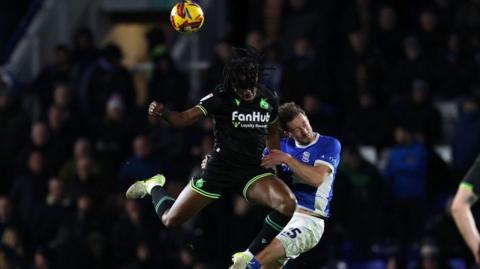 Ben Davies of Birmingham City challenges Promise Omochere of Bristol Rovers