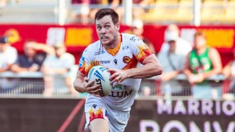 Luke Keary attacking with ball in hand for Catalans