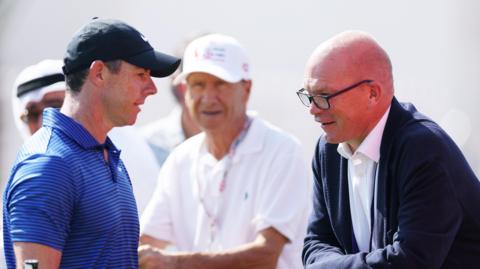 Rory McIlroy talks to DP World Tour chief executive Guy Kinnings