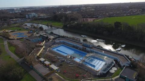 Aerial view of Hilsea lido under renovation - with part of the pool under a covering of scaffolding and work underway on surrounding ground.
