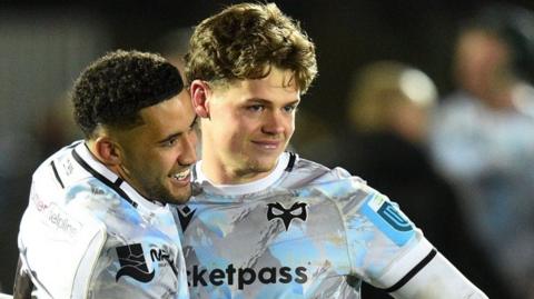 Keelan Giles (L) and Jack Walsh celebrate at Scotstoun