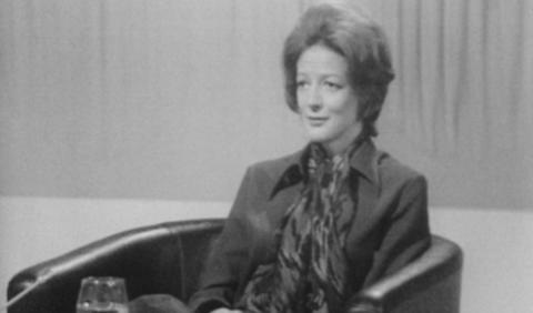 Maggie Smith sitting on a chair in studio during the interview