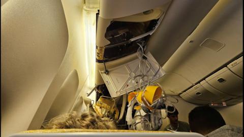 The interior of Singapore Airline flight SQ321 is pictured after an emergency landing at Bangkok's Suvarnabhumi International Airport