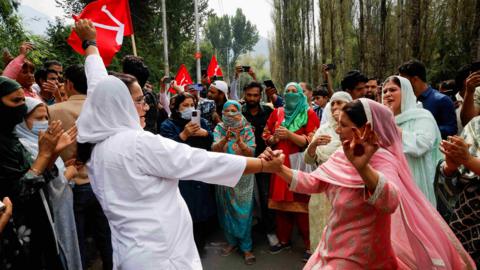 Supporters of the Jammu and Kashmir National Conference party celebrate outside the vote counting centre on the day of the assembly election results, in Srinagar, October 8, 2024.