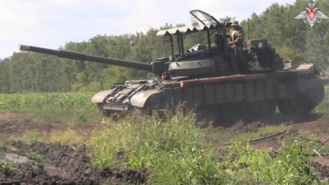 Russian soldiers are seen operating a tank in the Kursk region, western Russia, in a still image taken from footage released by the Russian defence ministry on 10 August 2024