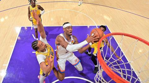 Oklahoma City Thunder's Shai Gilgeous-Alexander drives to the basket against the Los Angeles Lakers