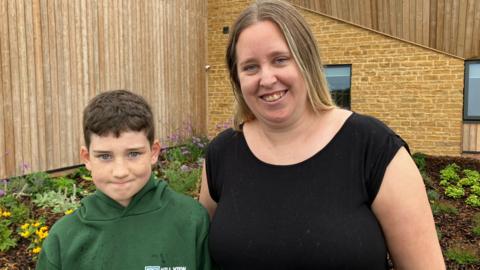 Ethan and his mum Leana outside Hill Viewspecial school near Yeovil