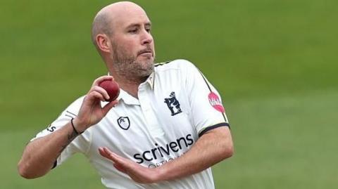Chris Rushworth is about to bowl the ball for Warwickshire