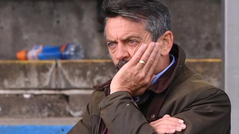 Southend boss Phil Brown watches on