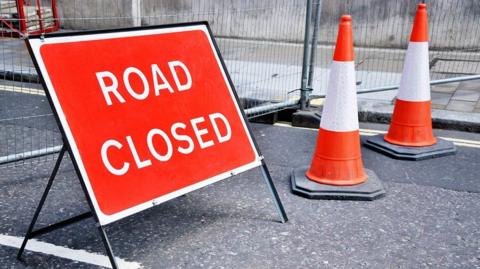 Snow road closed sign