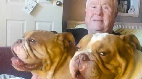 Ivan with his two English bulldogs 